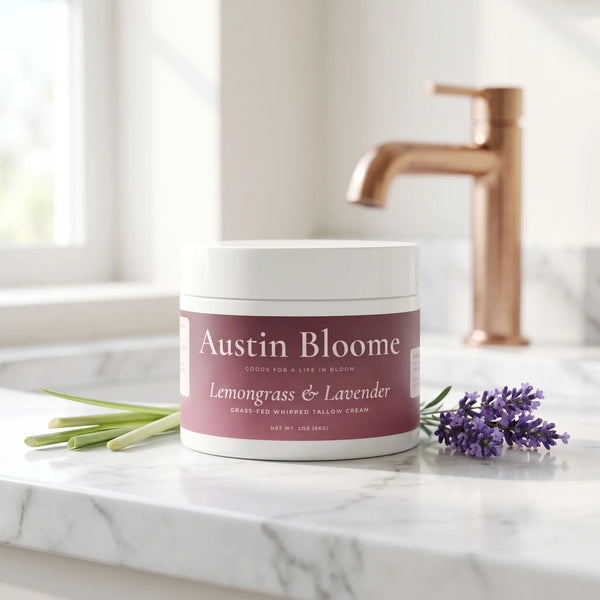 Tallow Cream Lemongrass & Lavender jar on a white marble bathroom benchtop with copper tapware