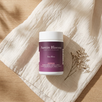 Sea Moss — linen and wood flat lay with dried flower