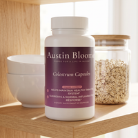 Colostrum Capsules on a sunlit open kitchen shelf with bowls and oats