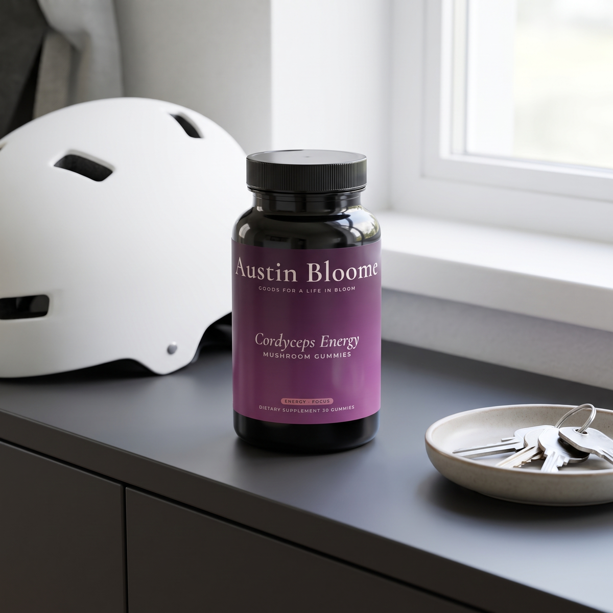 Cordyceps Energy Gummies on an entryway console beside a cycling helmet