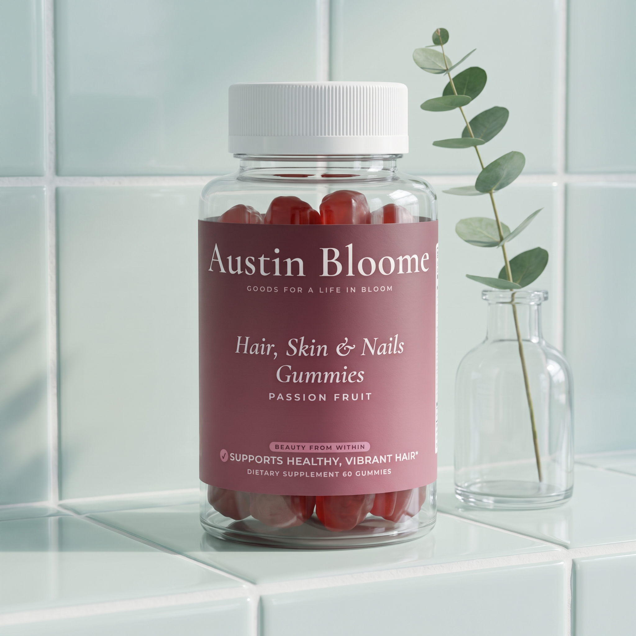 Hair, Skin & Nails Gummies on a pale tiled shelf with a eucalyptus stem