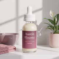 Dark Spot Serum on a bright shelf with window light, a mauve bowl and a peace lily