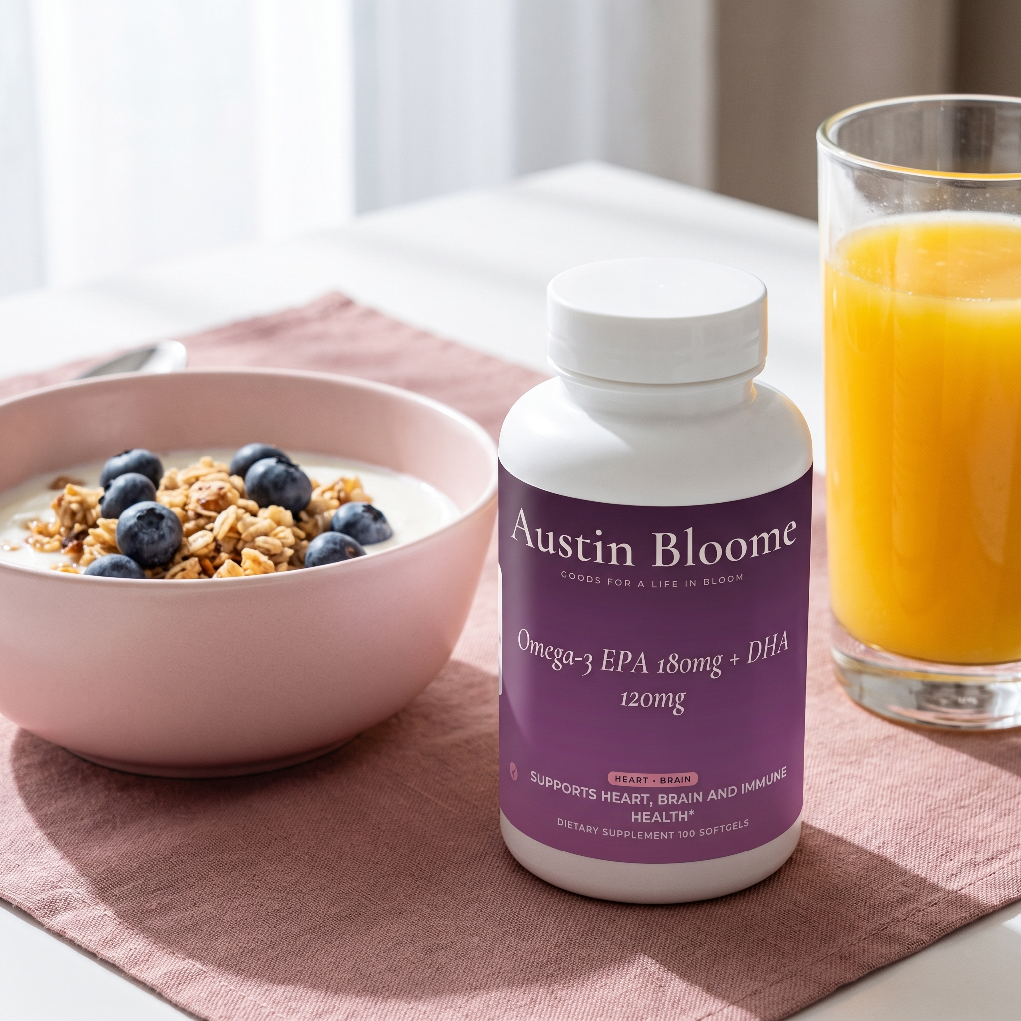 Omega-3 on a sunlit breakfast table with yoghurt, granola and orange juice